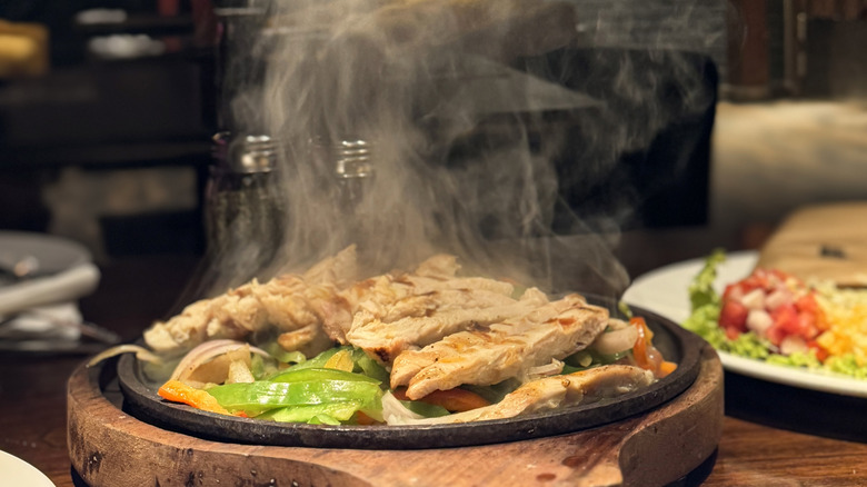 Steam rising from a plate of fajitas