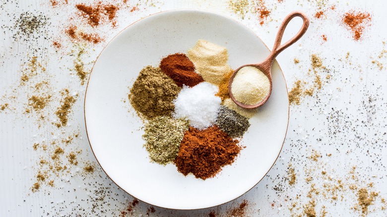 A plate of spices and seasonings