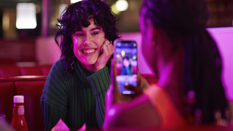 Friends taking a picture at a diner