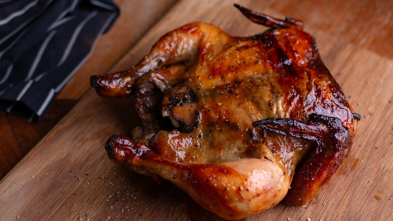 a rotisserie chicken with black areas