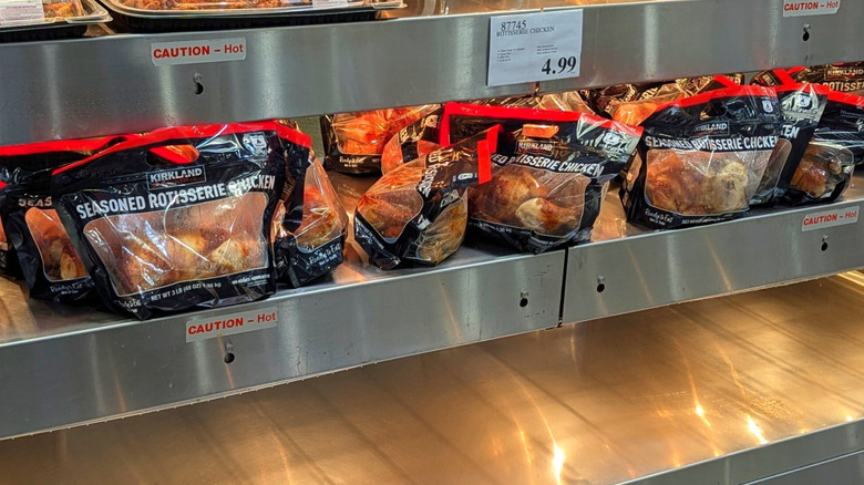 packaged rotisserie chickens on display