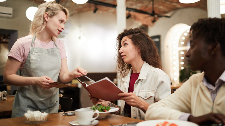 woman talking to waitress