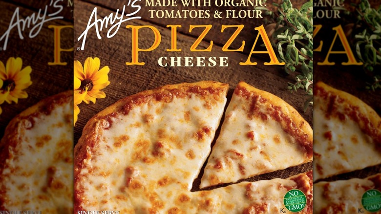 Portion of box of Amy's frozen cheese pizza, featuring logo, name of pizza, and top of cooked pizza