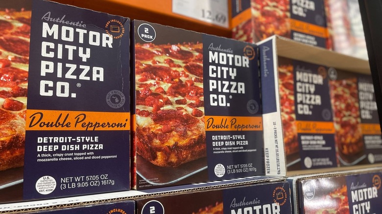 Freezer shelves full of boxes of Motor City Pizza Co. Double Pepperoni frozen pizza
