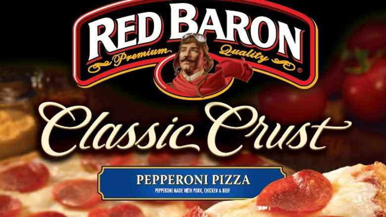 Closeup of Red Baron Classic Crust Pepperoni Pizza box showing logo, name, and top of cooked pizza