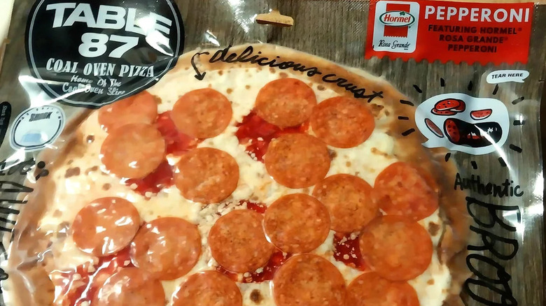 Closeup of vacuum-packed pouch containing Table 87 Coal Oven Pepperoni Pizza
