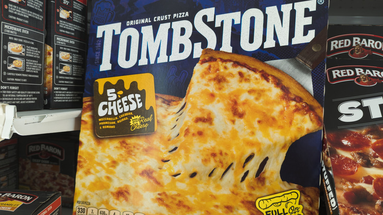 Box of Tombstone Original Crust 5 Cheese pizza on a grocery store freezer shelf