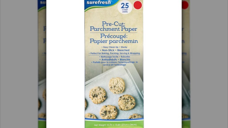 A box of Surefresh pre-cut parchment paper is displayed against a white background