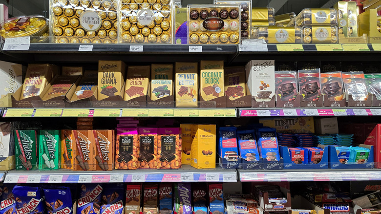 An assortment of chocolate bars on a store shelf