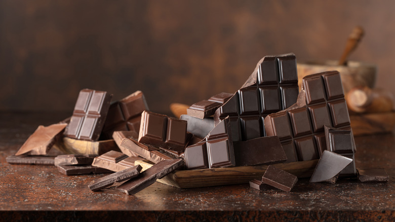Pieces of milk and bitter chocolate on a counter