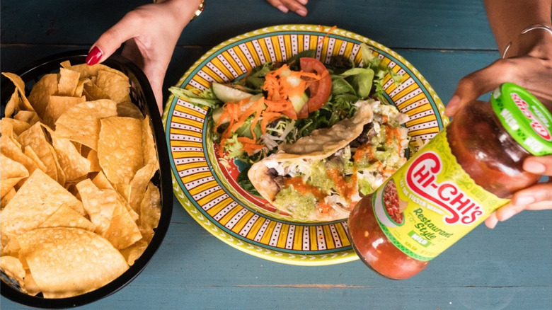 Chi-Chi's salsa with chips and tacos