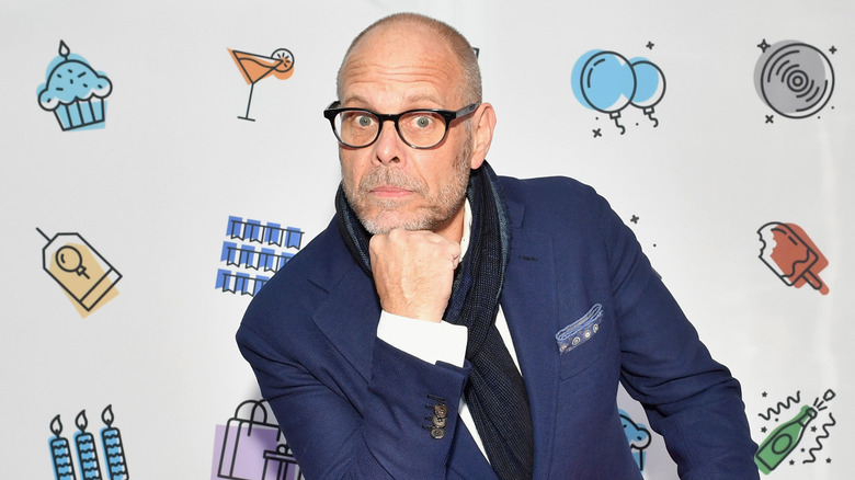 Alton Brown posing at an event.