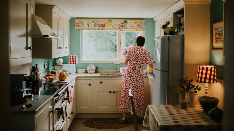 Person in retro kitchen with pattern and color