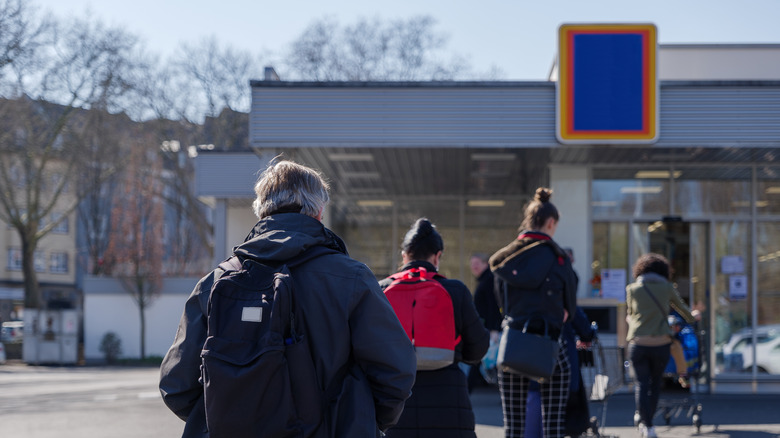 People waiting in line at Aldi