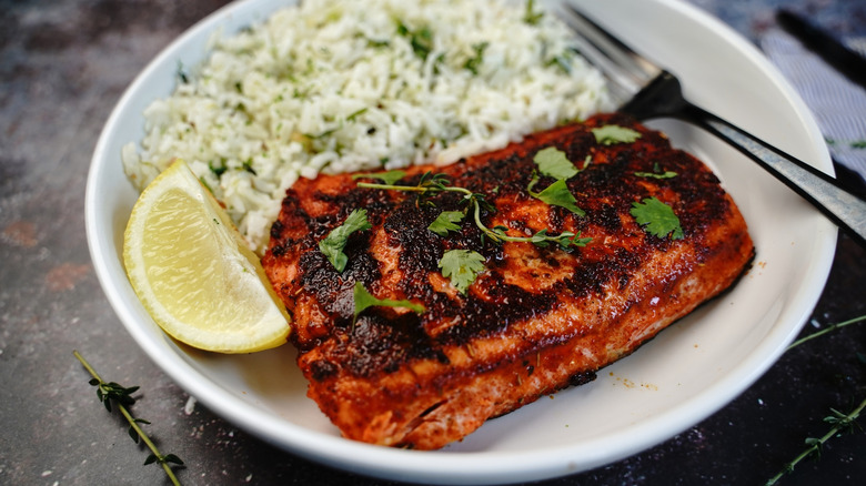 Blackened salmon with lemon and rice