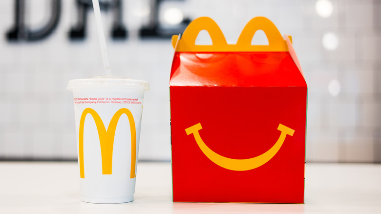 A McDonald's Happy Meal box and drink.