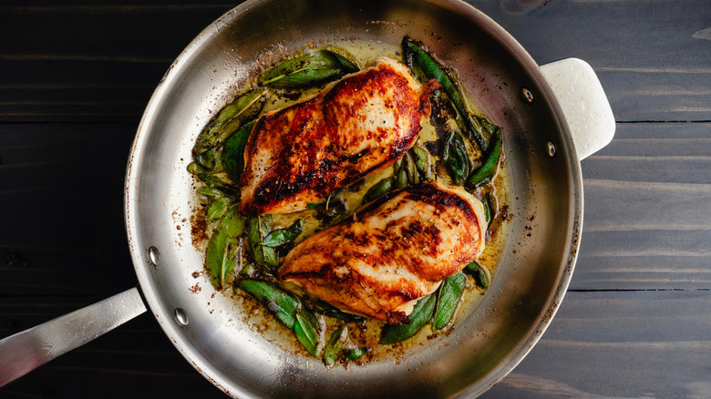 Chicken breasts on a pan.
