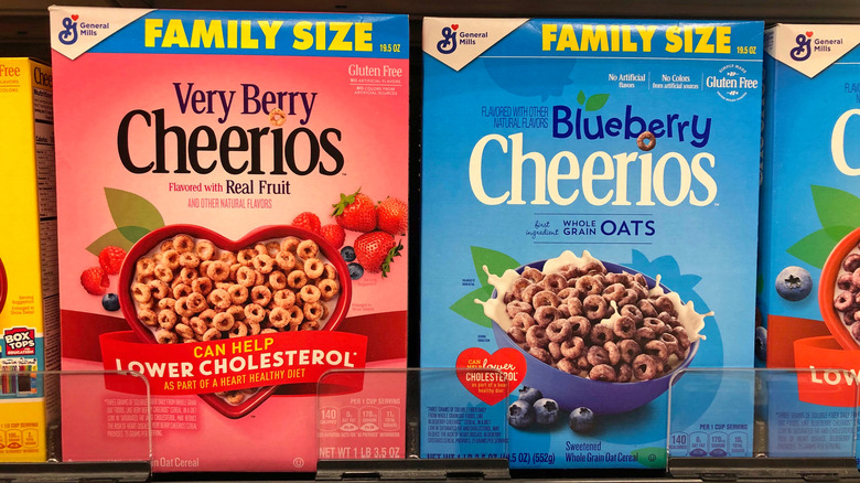 Very Berry Cheerios and Blueberry Cheerios are pictured on a grocery store shelf