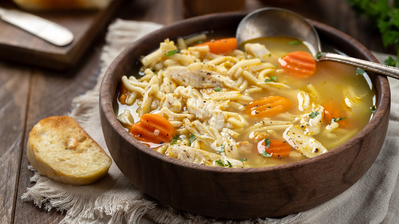 A vegetable rich chicken noodle soup