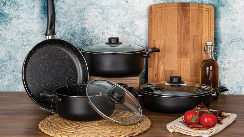 Black pots and pans in a kitchen