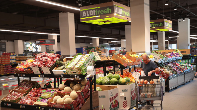 Shopper in the produce section of an Aldi