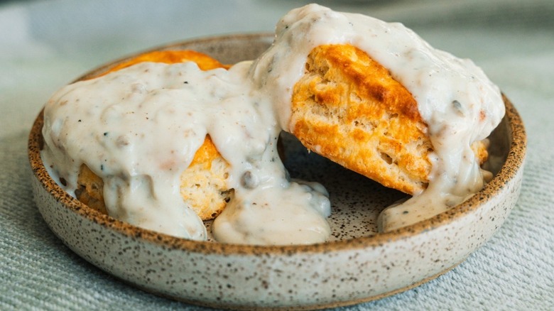 Close-up of Hardee's Biscuit N' Gravy on a gray plate.