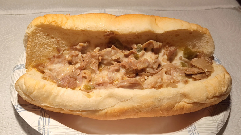 7-Eleven Classic Philly Cheesesteak on a paper plate
