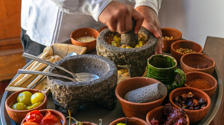 Mole ingredients being hand ground