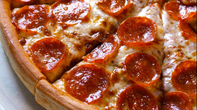 A close up of a thick pepperoni and cheese pizza from Godfather's Pizza.