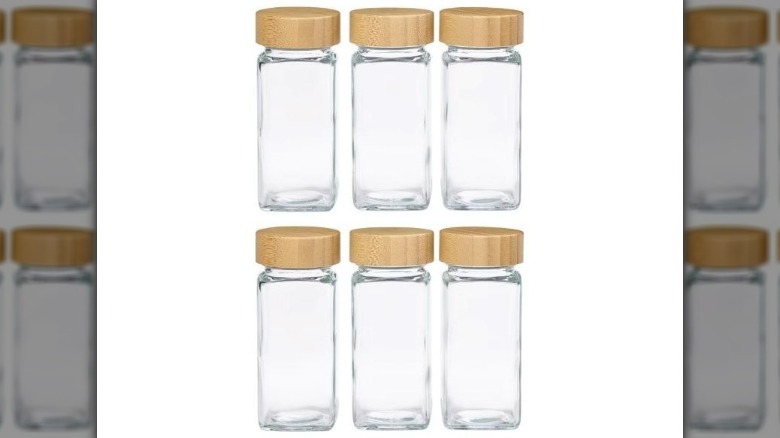 Six square glass spice jars with round wooden tops