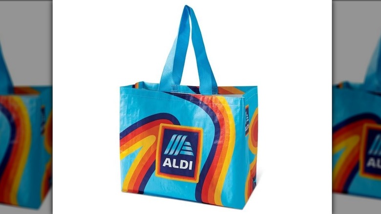 Aldi reusable shopping bag in light blue with log and purple, red, orange, and yellow logo colors swirl