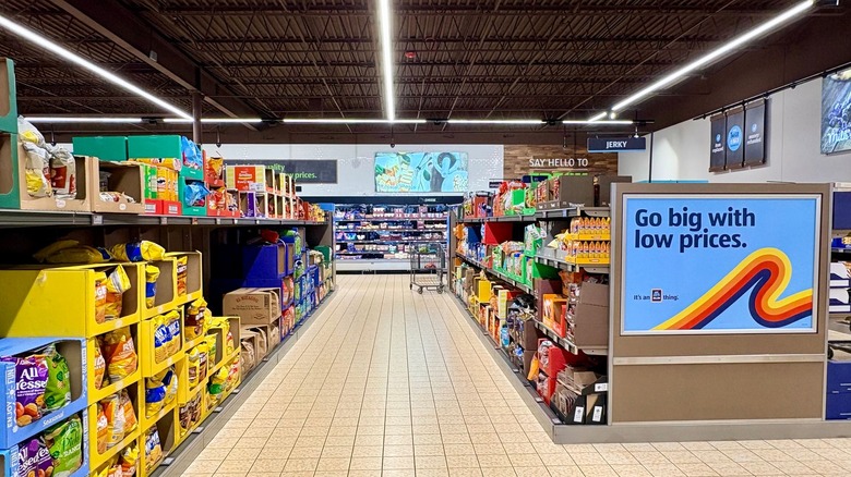 An Aldi snack aisle is filled with items.