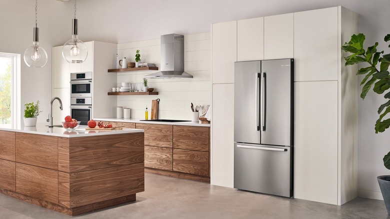 A Bosch 800 series French door bottom mount refrigerator in a home kitchen