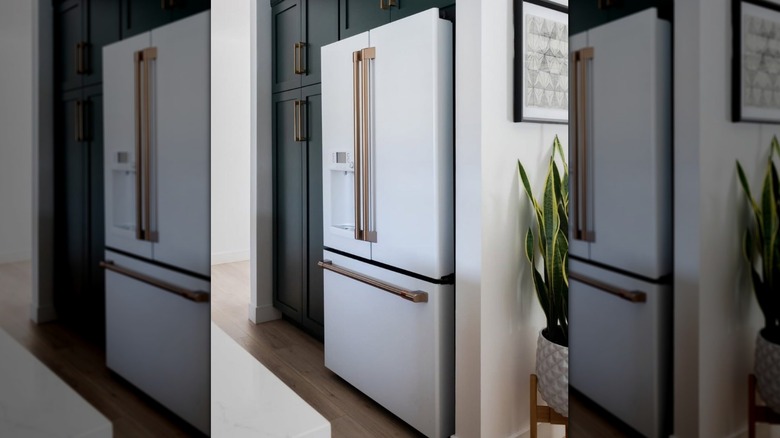 A white refrigerator with metallic hardware from GE's Cafe Appliance line