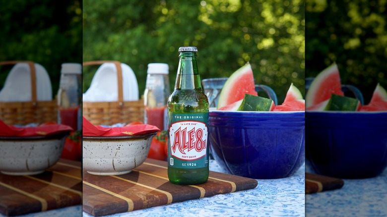 A glass bottle of Ale-8-One﻿ next to a bowl of cut watermelon