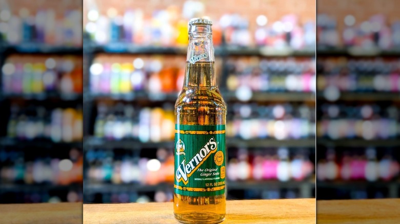 A glass bottle of Vernors Ginger Ale on a wood countertop
