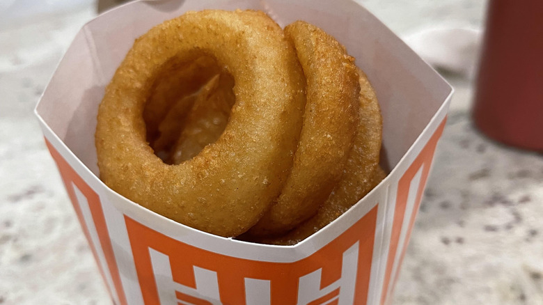 Order of Whataburger onion rings sitting on a table