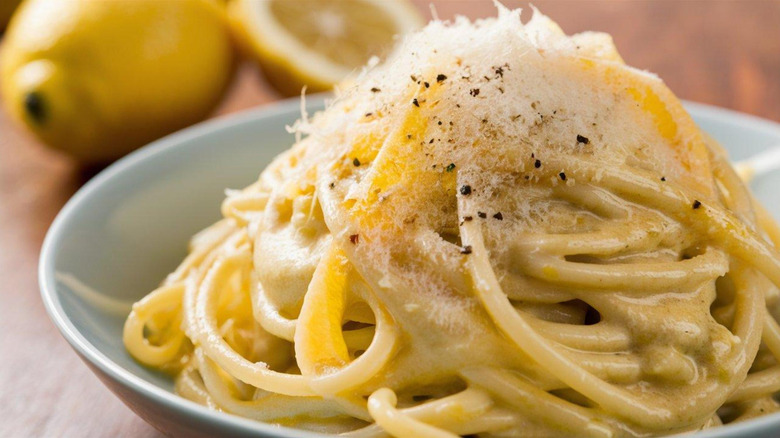 Closeup of pasta with lemon and white sauce