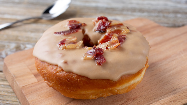 candied bacon bits on a donut