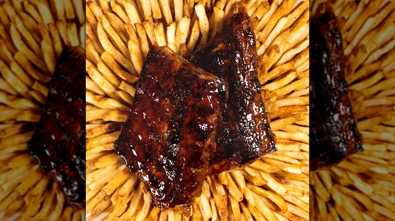 Chili's baby back ribs on top of fries.