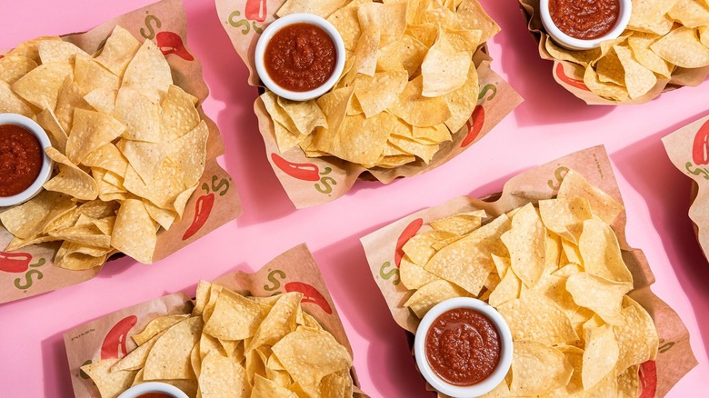 Several servings of Chili's chips and salsa.