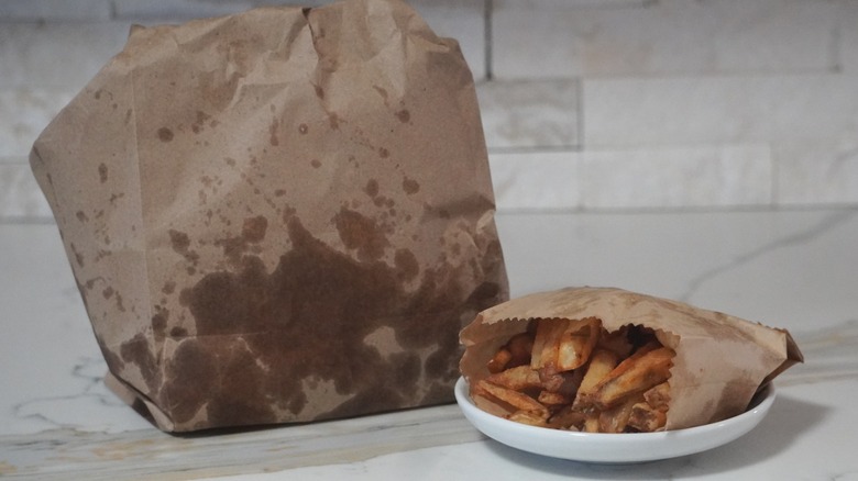 An opened bag of fries from Five Guys