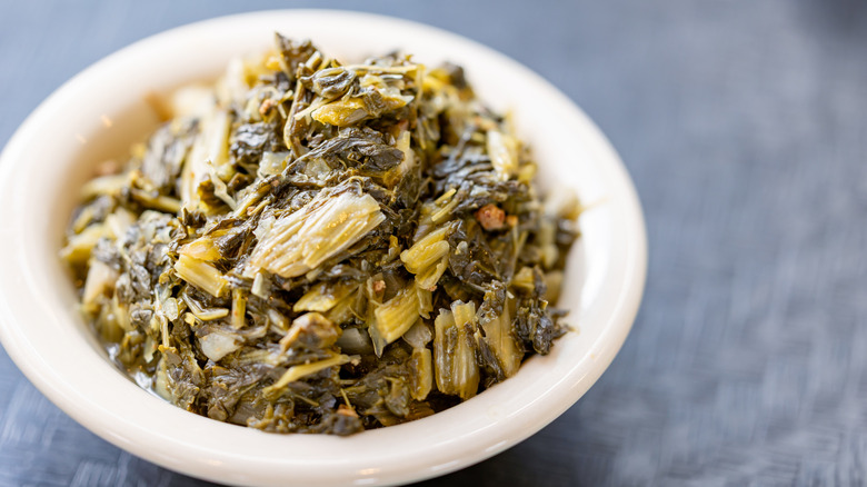 A bowl of cooked collard greens without meat