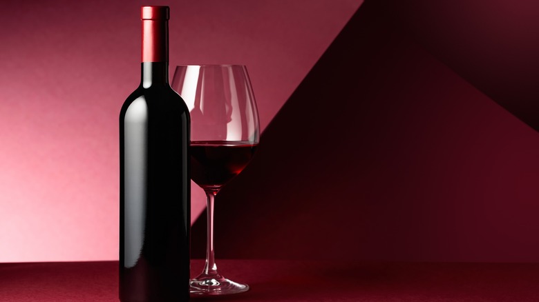 bottle and glass of red wine