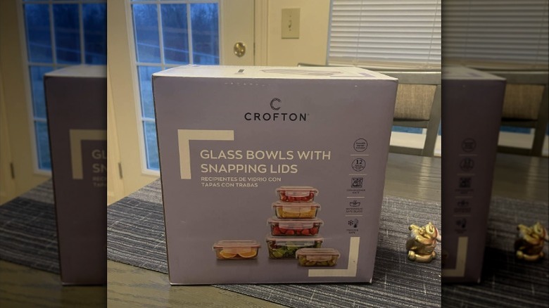 Aldi's Crofton-brand glass bowls with snapping lids sit in their box on a table