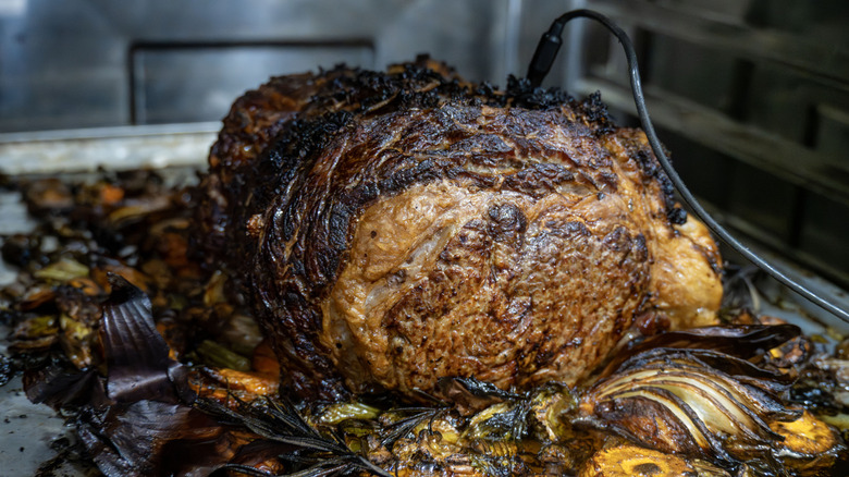 A prime rib roasting in the oven.