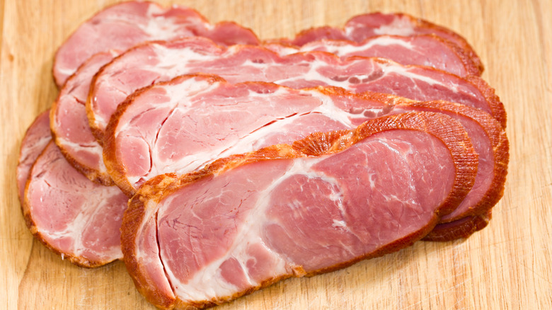Slabs of buckboard, or cottage, bacon on a table