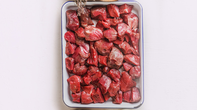 cubed beef in a baking dish