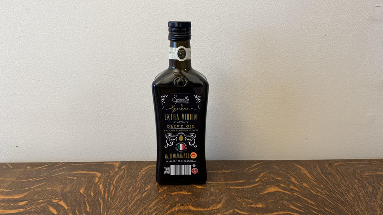 Aldi's Specially Selected Premium Sicilian Extra Virgin Olive Oil on a table.