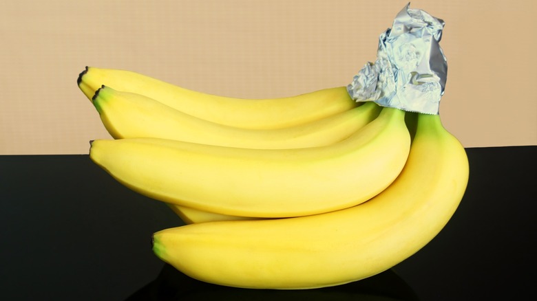 banana bunch with end wrapped in foil